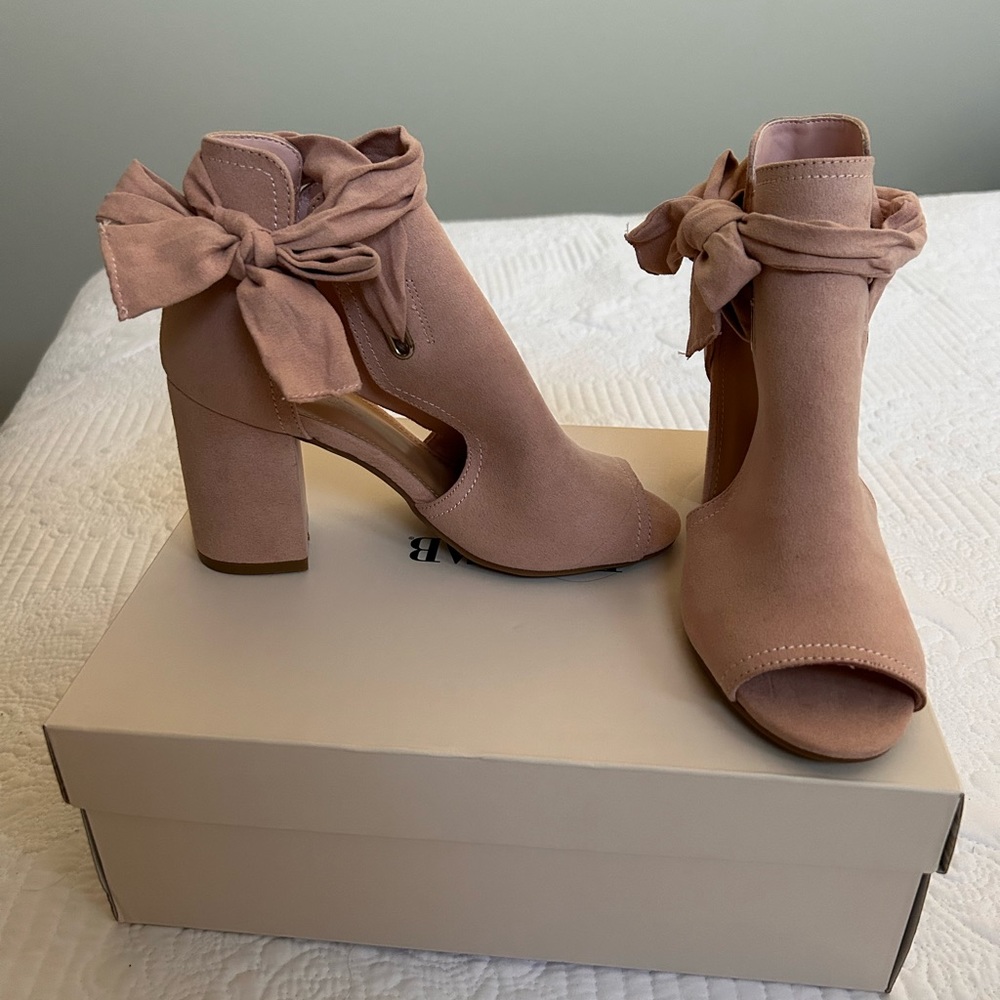 Brand new plush JUSTFAB heel boots.